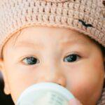 Adorable crochet baby fox hat with ears in orange yarn